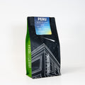 Coffee bag labeled 'Peru Norte Lima' with a black and green design on a white background