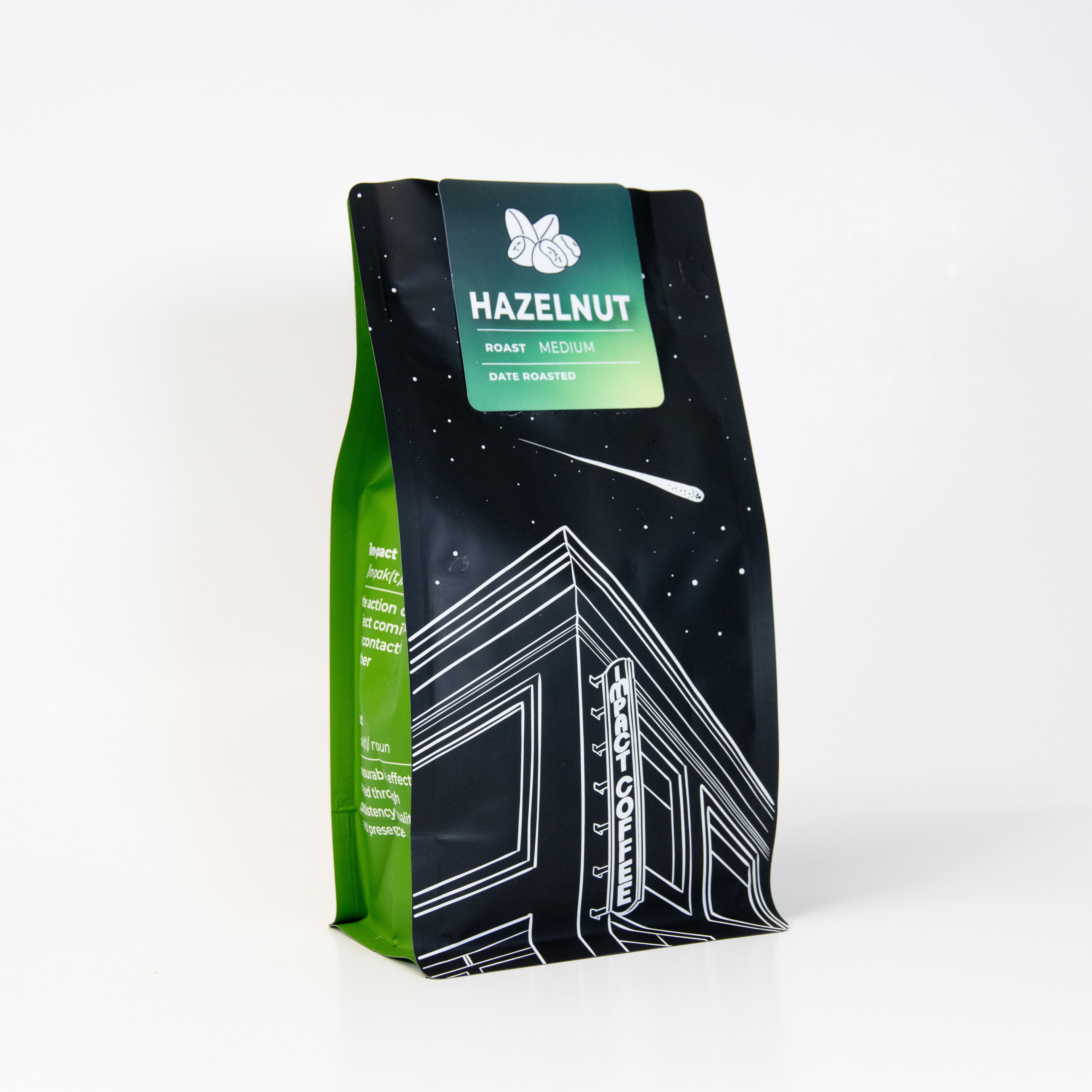 Green and black coffee bag with 'Hazelnut' flavor label on a white background