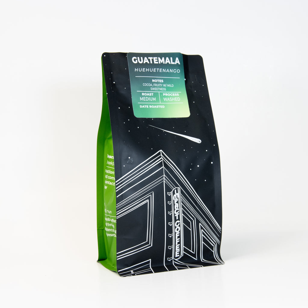 Coffee bag with 'Guatemala medium roast' and 'Huhuetenango' text on a white background