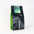 Coffee bag with 'Colombia Excelso' label on a white background